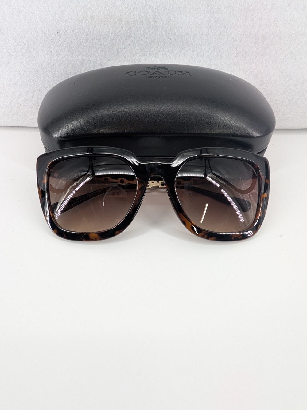 Coach square tortoiseshell sunglasses featuring brown gradient lenses